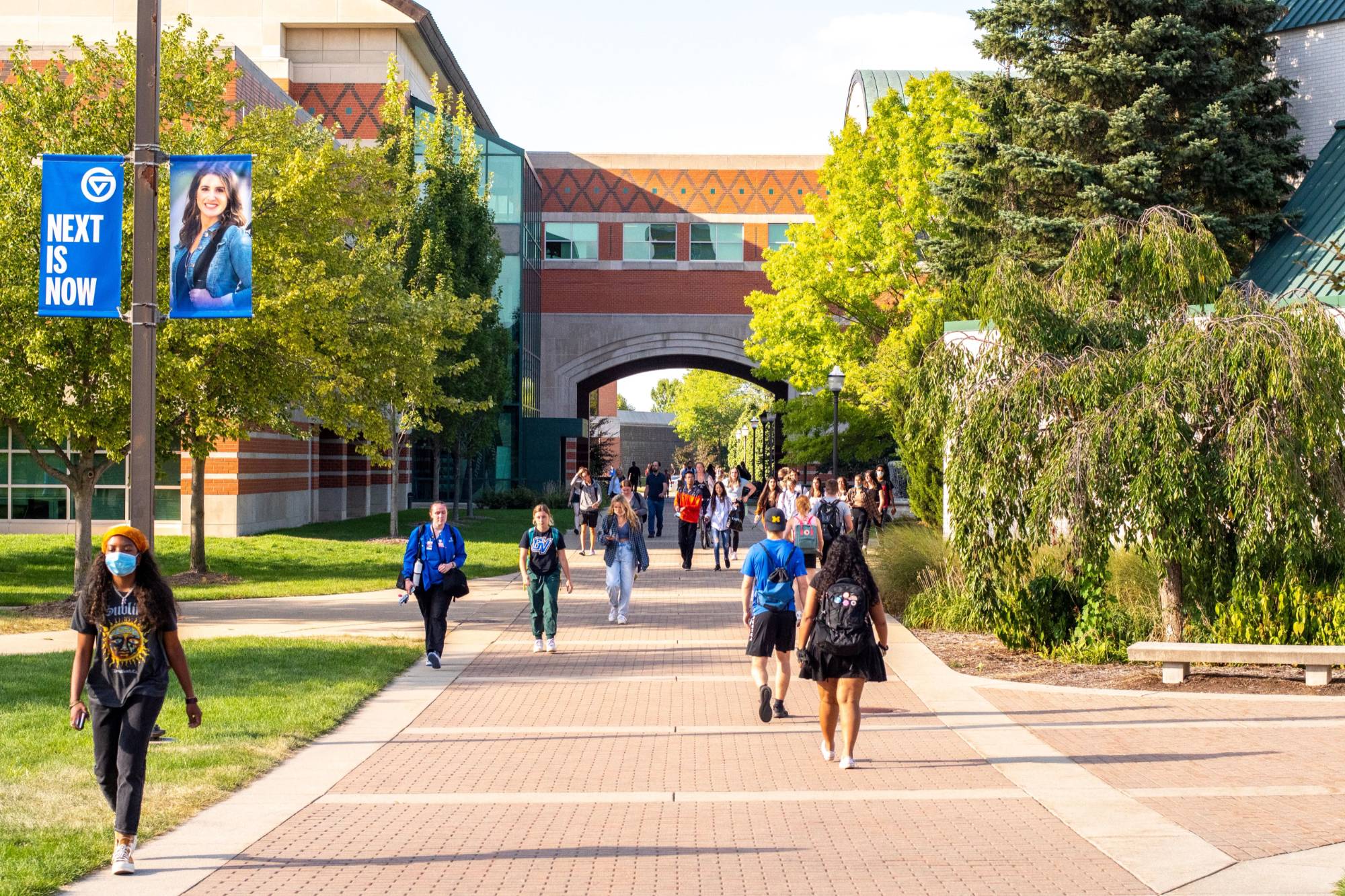 photo of students on walkway outside student services building on allendale campus